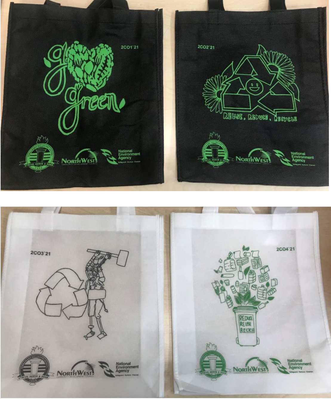 Four reusable tote bags with recycling-themed green designs, two black and two white, branded with NorthWest and National Environment Agency.